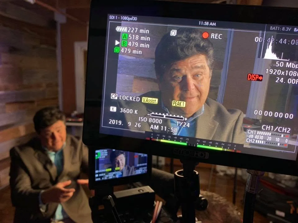 Interview subject framed on a professional production monitor